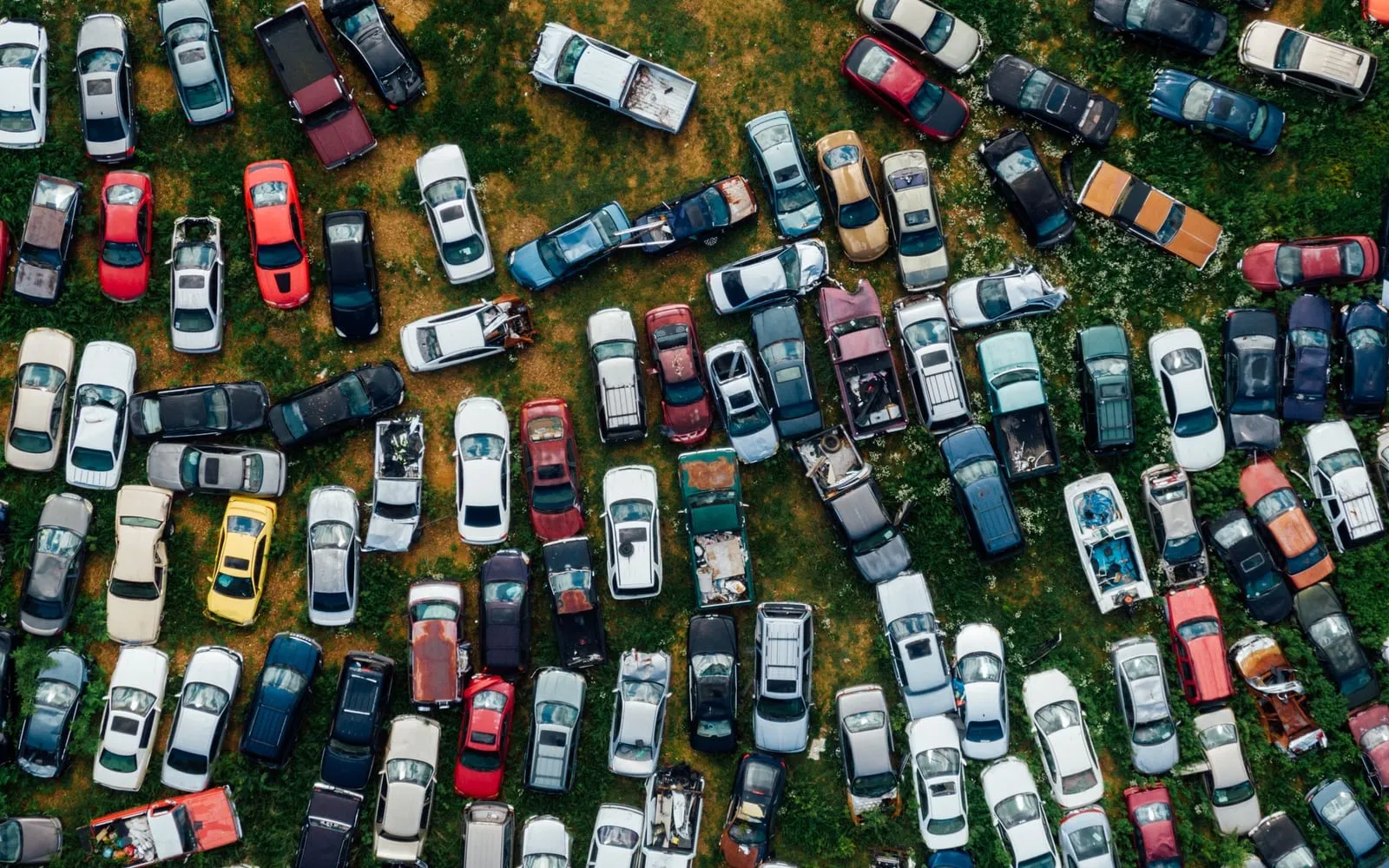 Rows of retired cars seen from above, packed side by side