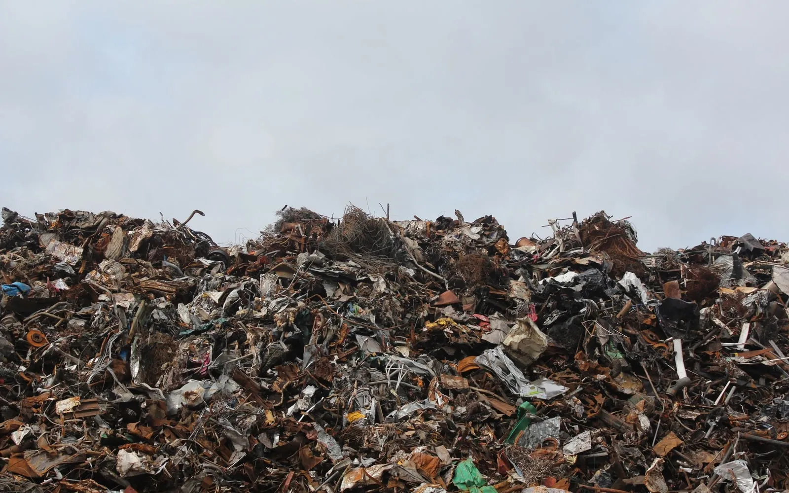Heap of mixed scrap metal waiting to be processed